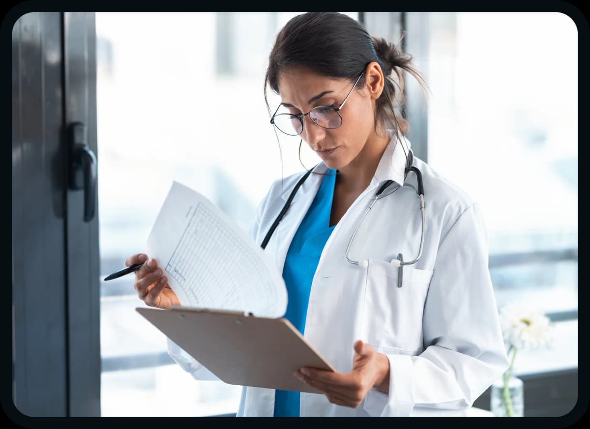 Doctor reviewing financial documents